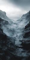 Misty rocky mountain pathway through rough terrain under gray skies photo