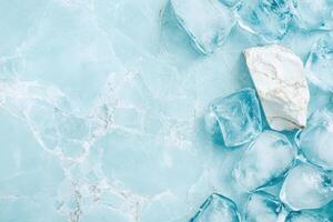 Smooth white stone surrounded by ice cubes on textured blue surface, abstract cool background photo