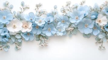 Elegant arrangement of blue and white paper flowers on white background creating a serene floral composition photo