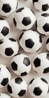 Multiple black and white soccer balls arranged tightly in a patterned formation photo