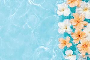 Tropical hibiscus flowers floating on tranquil blue water surface, creating a serene summer vibe photo