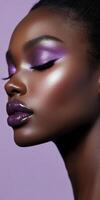 Elegant portrait of woman with shimmering purple makeup and glossy lips on soft lavender background photo