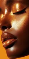 Close up of a woman's face with shimmering metallic makeup in golden light photo