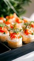 Gourmet smoked salmon canapes with cream cheese and dill garnish on a serving tray in elegant culinary presentation, photo