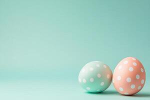 Pastel easter eggs with polka dots on a soft green background, photo