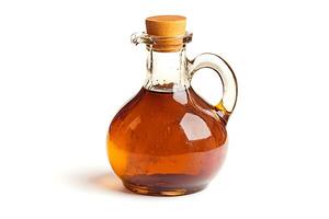 A bottle of maple syrup on a white background photo