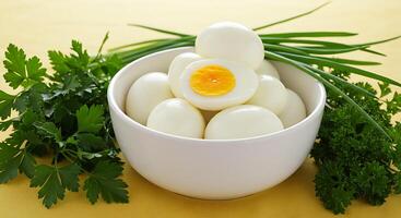A bowl of boiled eggs and parsley photo