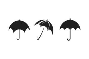 Three Black Umbrella Icons in Different Positions on a White Background vector