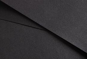 elegante negro papel textura con un reluciente, reluciente superficie y sutil minimalista líneas. foto