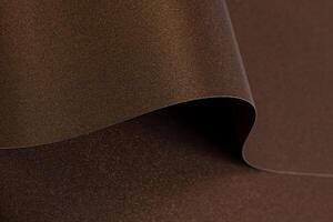 Rich brown paper background with a smooth, glossy texture and metallic bronze shimmer. Elegant waves photo