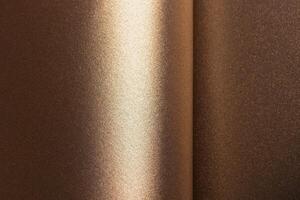 Warm brown and gold paper background with a pearlescent, metallic texture and shimmering effect. The photo