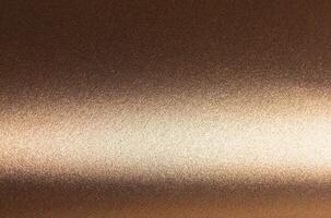 Elegant gold and bronze paper background with a smooth, pearlescent texture and shimmering metallic photo
