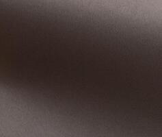 Gray paper background with a matte texture and subtle gradient effect. Neutral taupe and brown tones photo