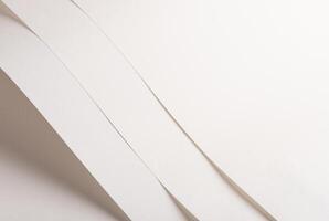 White and beige vellum paper background with a creamy, thin texture. Warm off-white tones create an photo