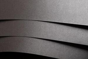Gray metallic paper background with a pearlescent, glossy texture. Silver tones create an elegant, photo