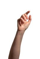 Female hand with slightly curved index finger reaching forward, making a tapping or picking gesture. photo