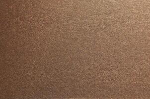 Elegant paper background with a smooth, grainy texture and a pearlescent finish. Warm gold and photo