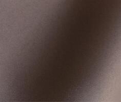 Mocha mousse paper background with a soft matte texture and subtle grainy effect. Rich, neutral photo