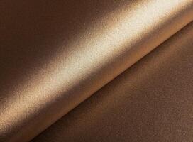 Elegant paper background with a glossy, pearlescent texture and a shimmering gradient effect. Warm photo