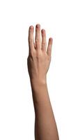 Female hand showing four fingers with the thumb folded down, symbolizing the number four or counting photo