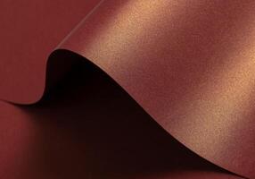 Burgundy paper background with a glossy, pearlescent texture and a shimmering finish. Warm, rich photo