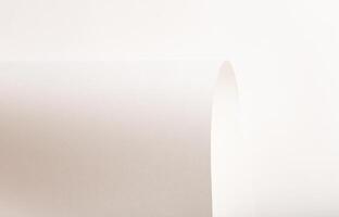 White and beige paper background with a smooth, soft texture. Warm off-white tones create an elegant photo