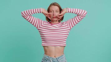 Funny comical woman making silly facial expressions and grimacing, fooling around, showing tongue video