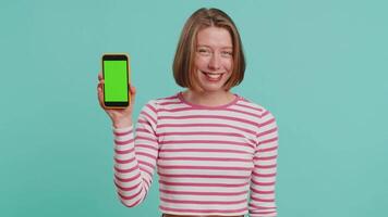 Developer woman hold smartphone with green screen chroma key mock up recommend good application video