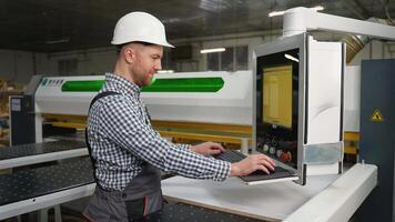 Factory Worker Operating CNC Cutting Machine video