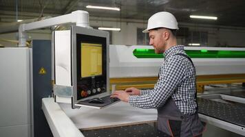 Operator Programs CNC Machine for Wood Panel Cutting video