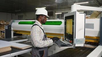 CNC Operator Cutting Laminated Boards for Furniture video