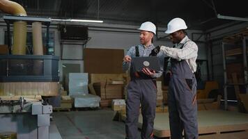 Two Engineers Discuss MDF Cutting on Laptop video