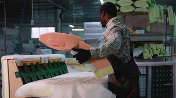 Worker Assembling Sofa Frame with Upholstery Foam video
