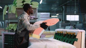 Man Assembling Upholstery Foam on Sofa Backrest video