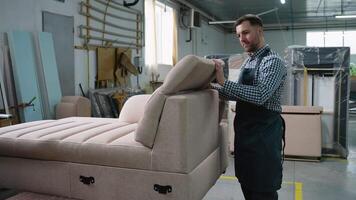 Man Assembling Adjustable Sofa Backrest in Workshop video