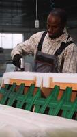 Man Using Staple Gun on Sofa Frame Upholstery video