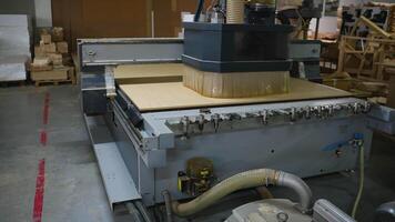 CNC Router Cutting Wood Panel in Workshop video