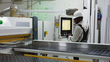 Worker Operating CNC Panel Saw in Wood Factory video