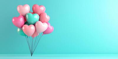 Colorful heart shaped balloons in pink and blue against turquoise background photo