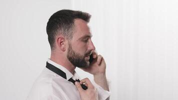 Multitasking, stressed man talking by phone in office, burnout or accountant on audit. Financial, taxes and time management anxiety or frustrated by challenge with schedule or deadline video