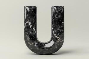 The letter U is made of marble and has a unique, abstract shape photo