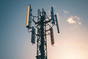 A tall tower with a lot of antennas on it photo