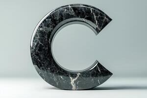 The letter C is made of marble and has a unique, curved shape photo
