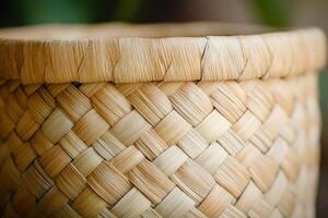 A basket made of woven straw with a brown and tan color photo