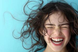 A woman with curly hair is smiling and laughing photo