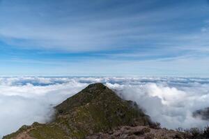 A wilderness with rolling mountains shrouded in mist photo