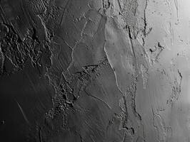 A black and white photo of a wall with some paint on it