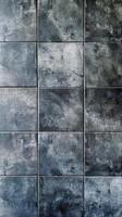 A large black and white tile wall with a dark gray background photo