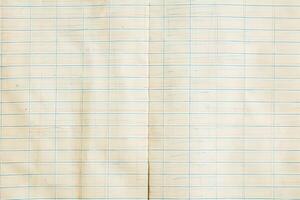 An old notebook with a grid on it photo