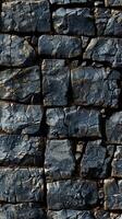 A stone wall with cracks and cracks in it photo